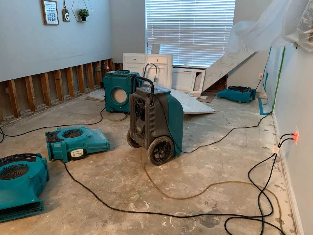 Dehumidifier in flood-cut room for Water Damage Restoration in Galt